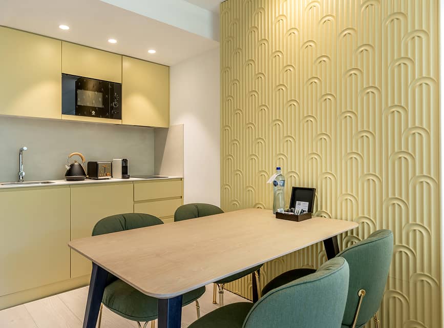 Fully equipped kitchen at Illa d'Or Apartments Fully equipped kitchen with microwave, kettle and coffee machine, next to the apartment's dining table
