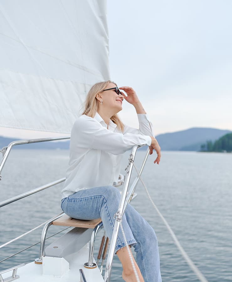 Hotel on the Mediterranean A woman sailing on a yacht in the Mediterranean