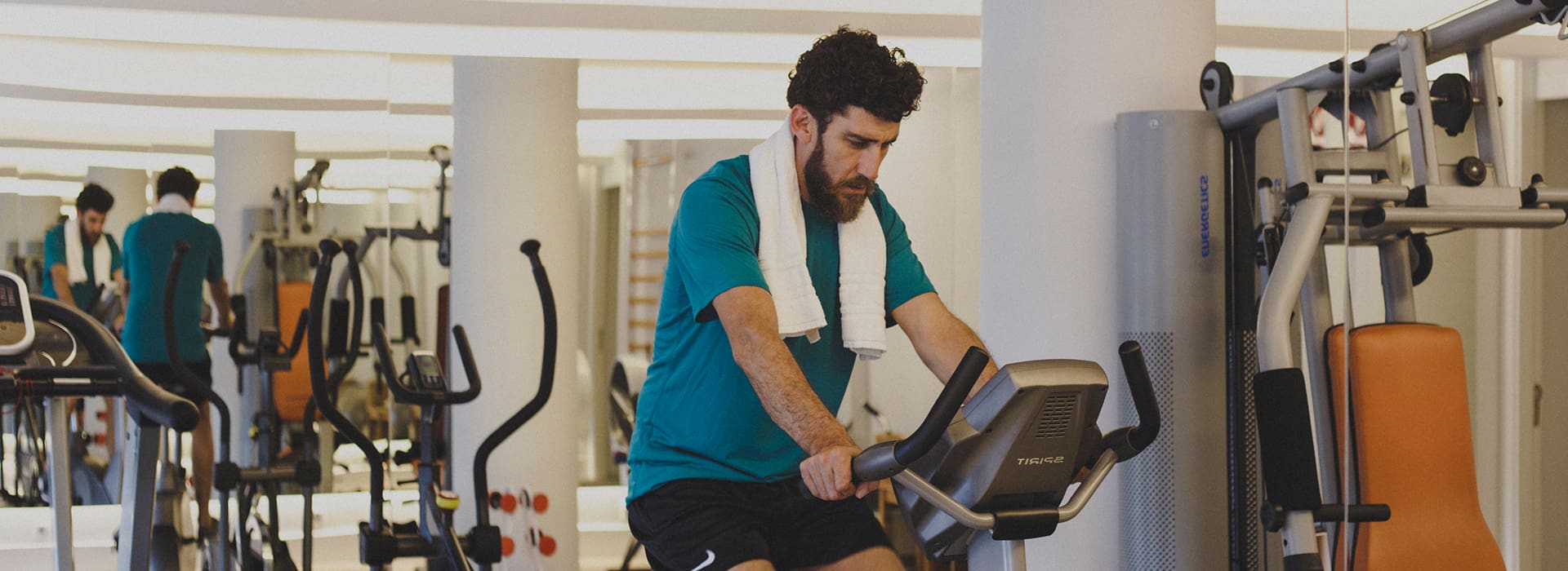 Hotel Illa d'Or | Gym A guest using the exercise bike in the hotel gym